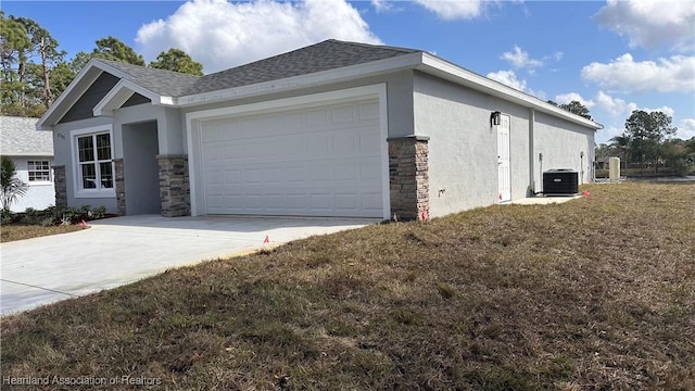 view of side of home featuring a garage and central AC unit