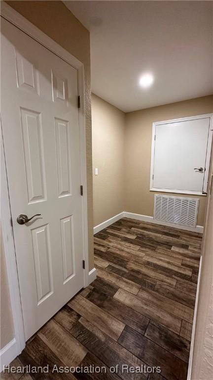 unfurnished room featuring dark hardwood / wood-style flooring