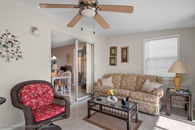 tiled living room with ceiling fan