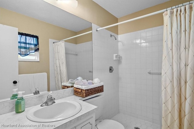 bathroom with a shower with curtain, vanity, and toilet