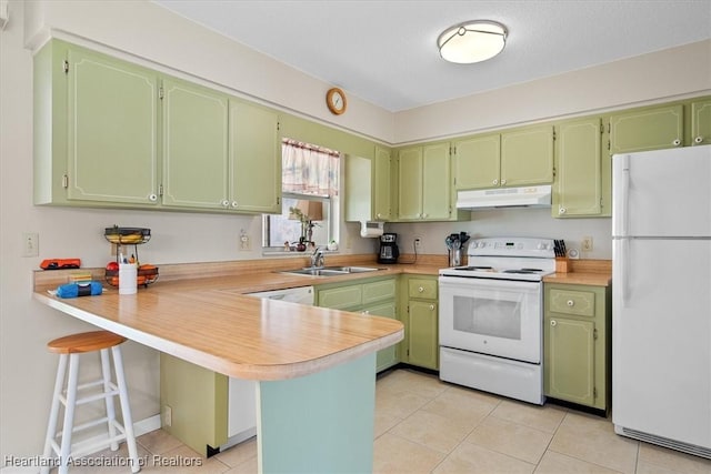 kitchen with a kitchen bar, sink, light tile patterned floors, kitchen peninsula, and white appliances