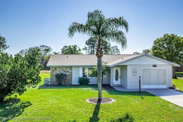 ranch-style home featuring a garage and a front lawn