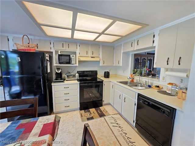 4618 Lafayette Ave, Sebring, FL 33875 - kitchen with black appliances, under cabinet range hood, and light countertops