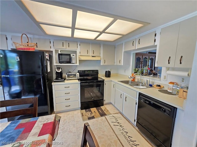 4618 Lafayette Ave, Sebring, FL 33875 - kitchen featuring black appliances, under cabinet range hood, and light countertops