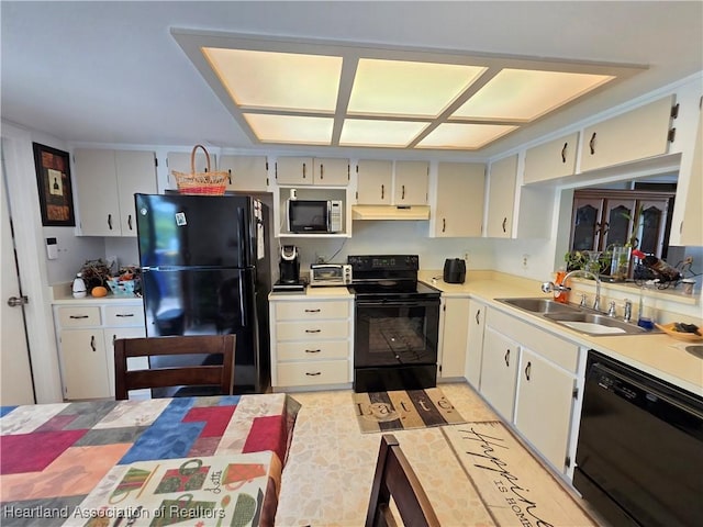 4618 Lafayette Ave, Sebring, FL 33875 - kitchen featuring black appliances, under cabinet range hood, and light countertops
