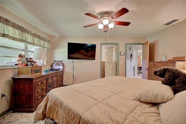 bedroom featuring a textured ceiling and ceiling fan