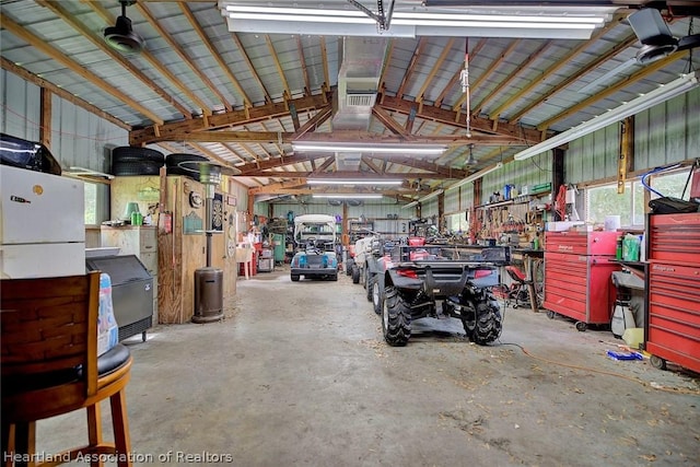 garage featuring a garage door opener and a workshop area