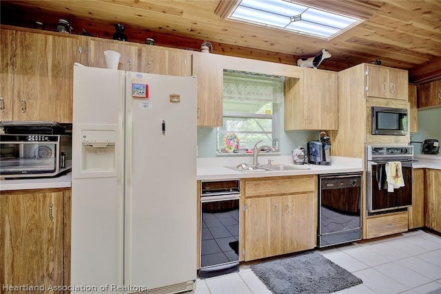 kitchen with wall oven, white refrigerator with ice dispenser, sink, dishwasher, and light tile patterned floors