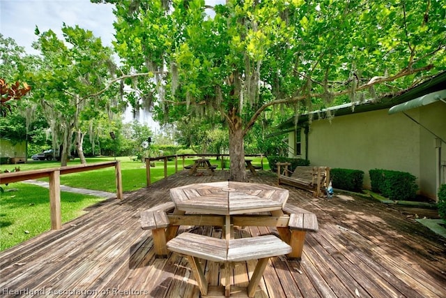 wooden deck with a yard