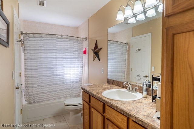 bathroom with vanity, toilet, and tile patterned flooring