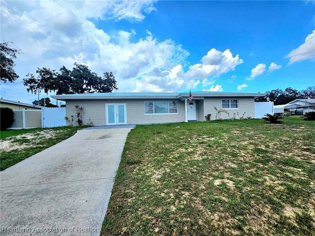 908 Taseschee Dr, Sebring, FL 33870 - ranch-style house featuring french doors and driveway