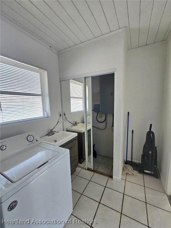 908 Taseschee Dr, Sebring, FL 33870 - laundry room with washer / clothes dryer, light tile patterned flooring, wood ceiling, and a sink