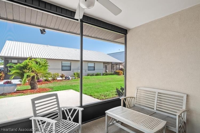 sunroom / solarium with ceiling fan