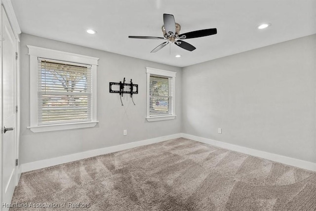 unfurnished room with carpet floors and ceiling fan