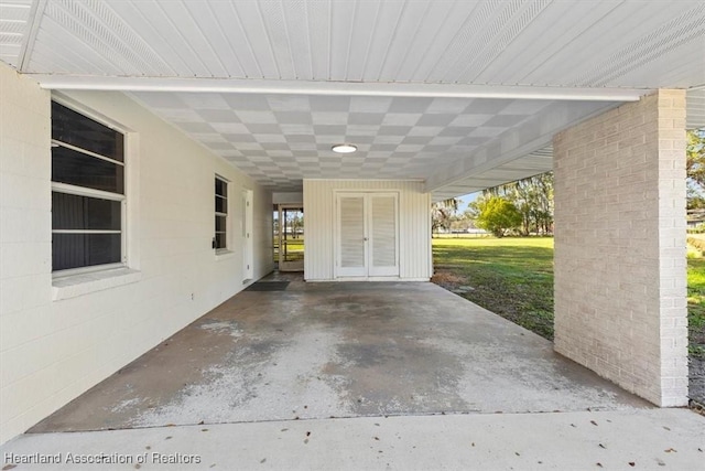 view of patio featuring a carport and french doors