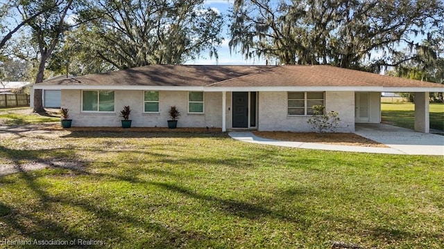 single story home with a carport and a front yard