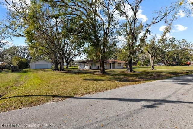 single story home with a front yard