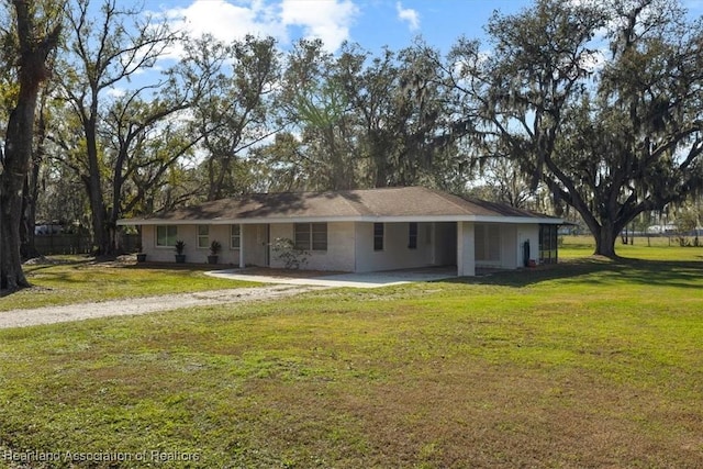 ranch-style home with a front lawn