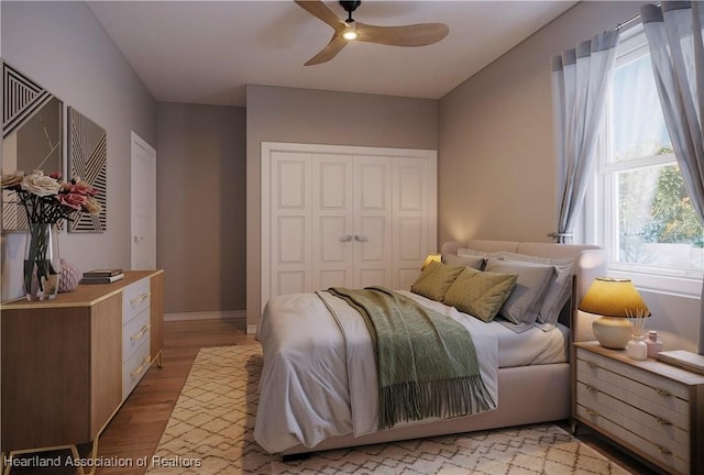 bedroom featuring light hardwood / wood-style floors and ceiling fan