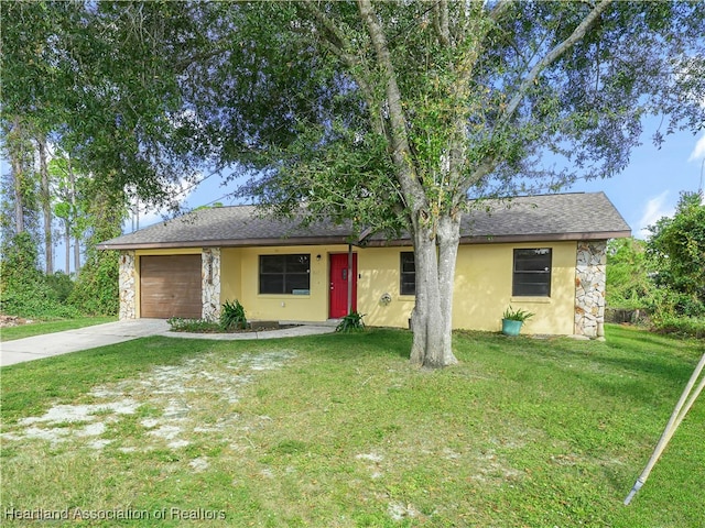 view of front of property with a garage and a front yard