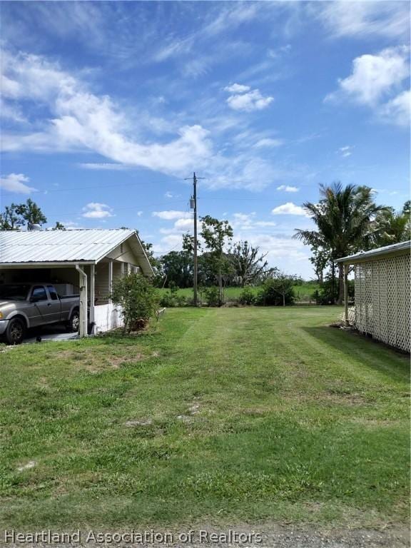 view of yard featuring a carport