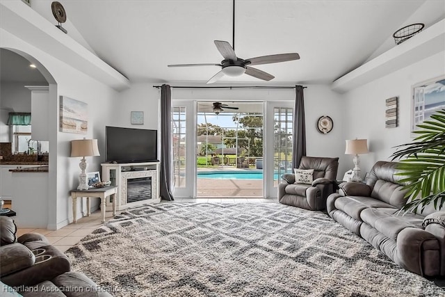 living room featuring ceiling fan and light tile patterned floors