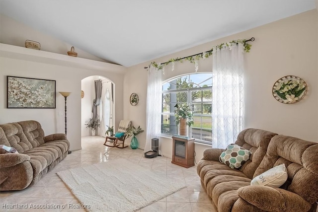 tiled living room with vaulted ceiling