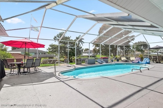 view of pool featuring a lanai and a patio area