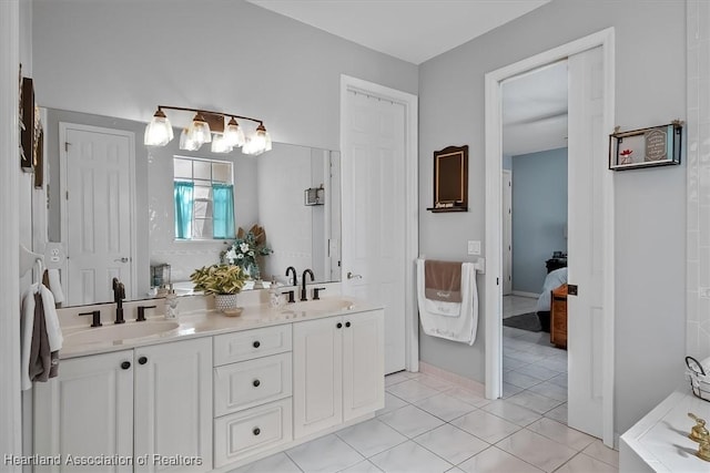 bathroom featuring tile patterned floors and vanity