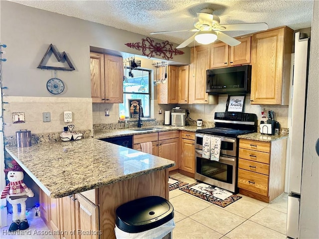 kitchen featuring sink, a kitchen breakfast bar, double oven range, kitchen peninsula, and light stone countertops