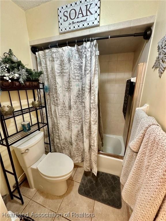 bathroom with tile patterned flooring, shower / bathtub combination with curtain, a textured ceiling, and toilet