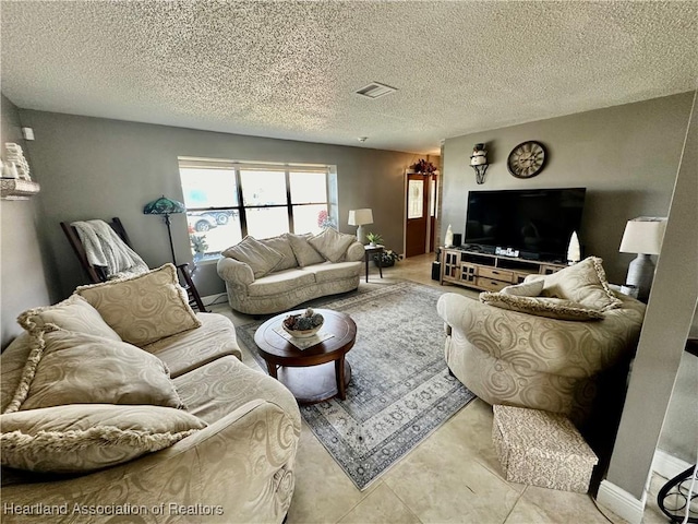 tiled living room with a textured ceiling