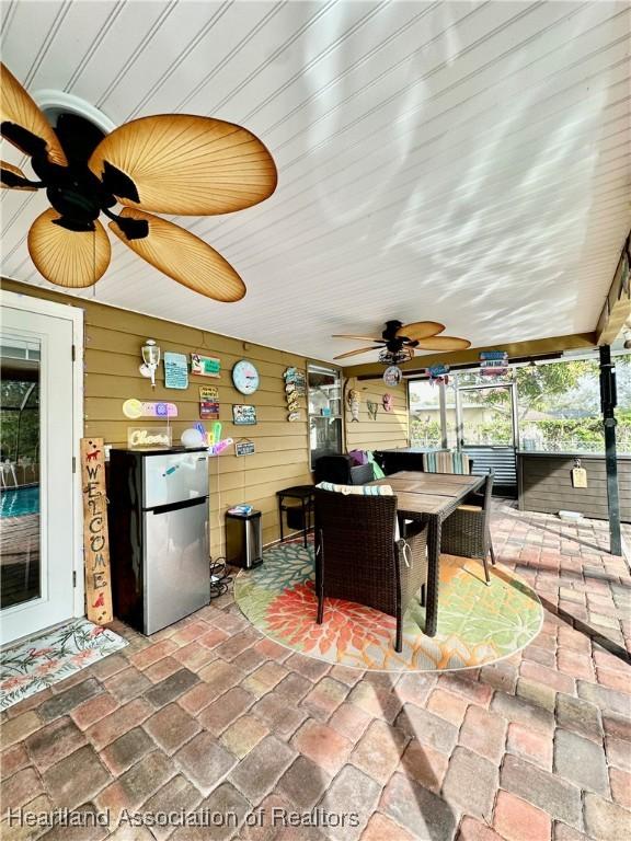 view of patio featuring ceiling fan