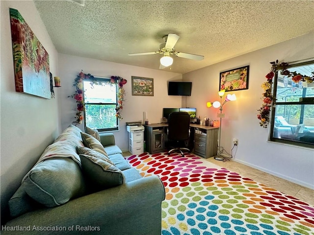 office featuring ceiling fan and a textured ceiling