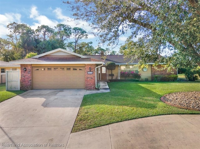 ranch-style home featuring a garage and a front yard