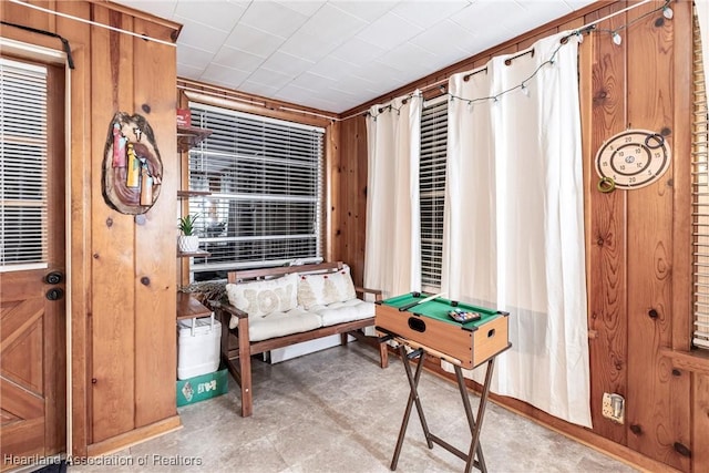 interior space featuring wooden walls