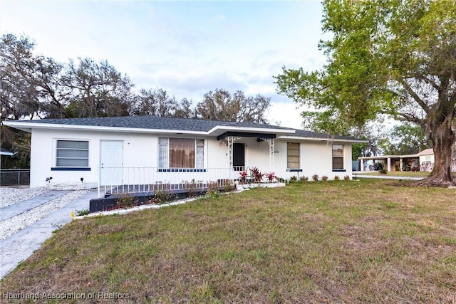 single story home featuring a front yard and stucco siding