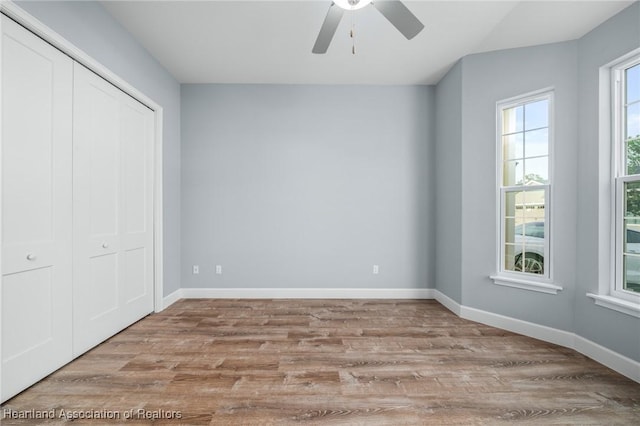 35151 Daily Dr, Sebring, FL 33872 - unfurnished bedroom featuring ceiling fan, a closet, and light hardwood / wood-style floors