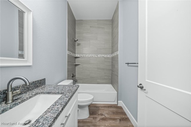 35151 Daily Dr, Sebring, FL 33872 - full bathroom featuring hardwood / wood-style flooring, vanity, toilet, and tiled shower / bath combo
