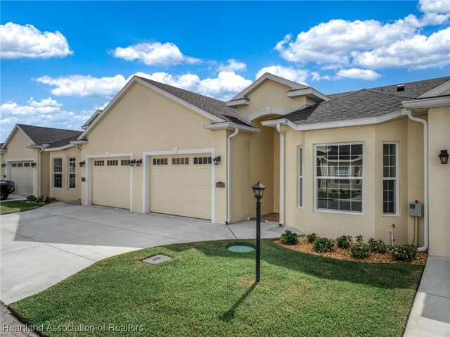 35151 Daily Dr, Sebring, FL 33872 - view of front of home with a garage and a front yard