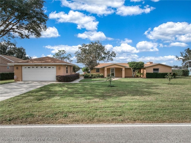 single story home featuring stucco siding, a garage, driveway, and a front lawn