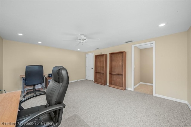 office area with light colored carpet and ceiling fan