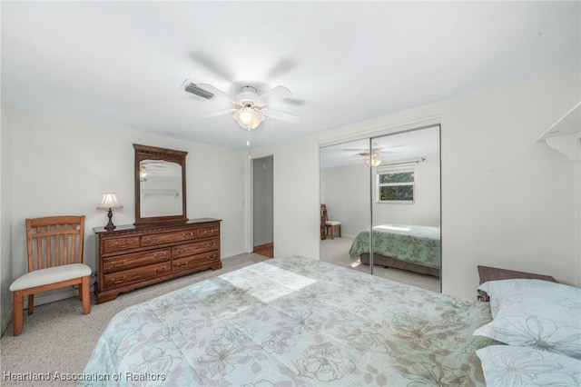 bedroom featuring ceiling fan and a closet