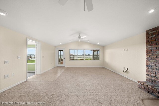 unfurnished living room with ceiling fan, carpet flooring, lofted ceiling, baseboards, and recessed lighting