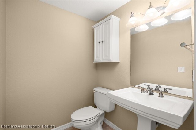 office featuring light carpet, ceiling fan, recessed lighting, and baseboards