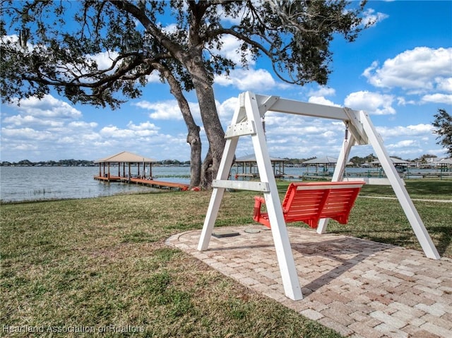 exterior space with a yard and a water view