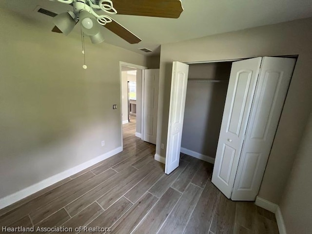 unfurnished bedroom featuring a closet and ceiling fan