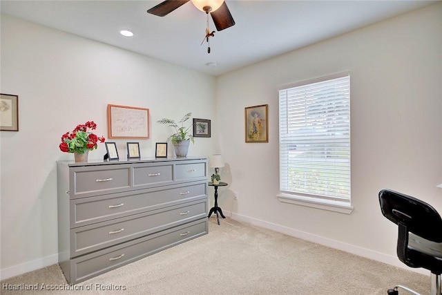 misc room featuring light carpet and ceiling fan