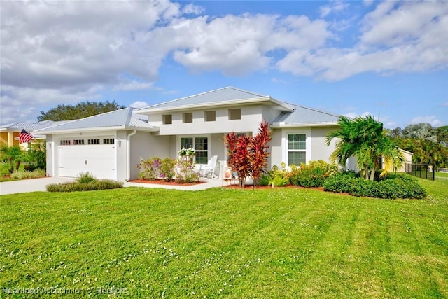 view of front facade featuring a garage and a front yard