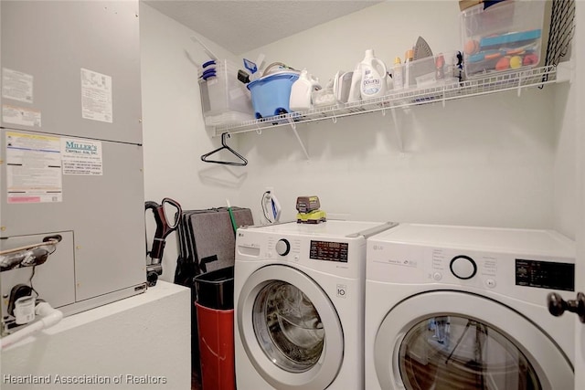 washroom with heating unit and independent washer and dryer